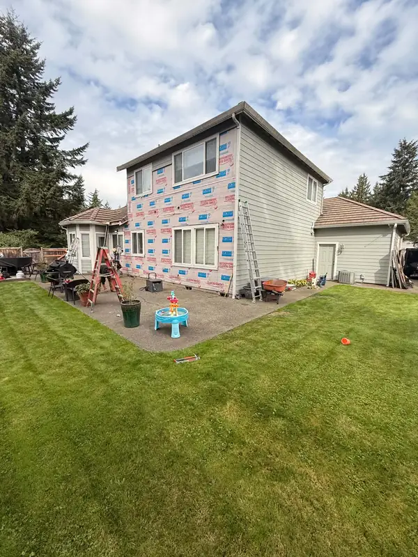 House wrap installed over the sheathing on the back of the house