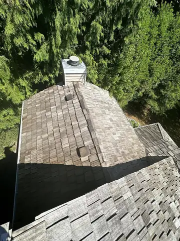 Shingle roof around a chimney